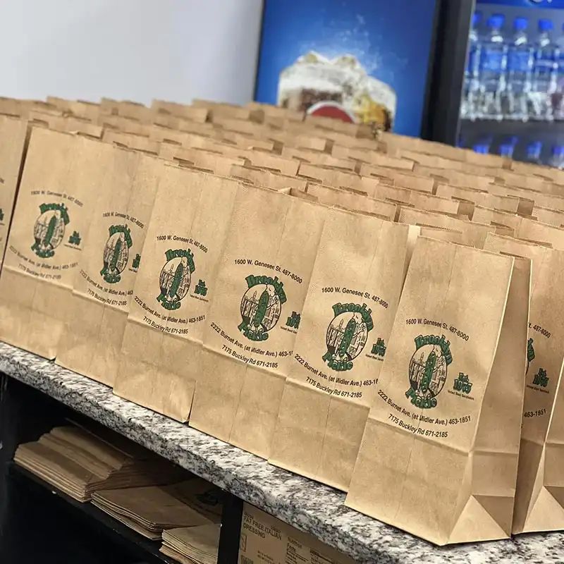 Lineup of bagged boxed lunches on the counter