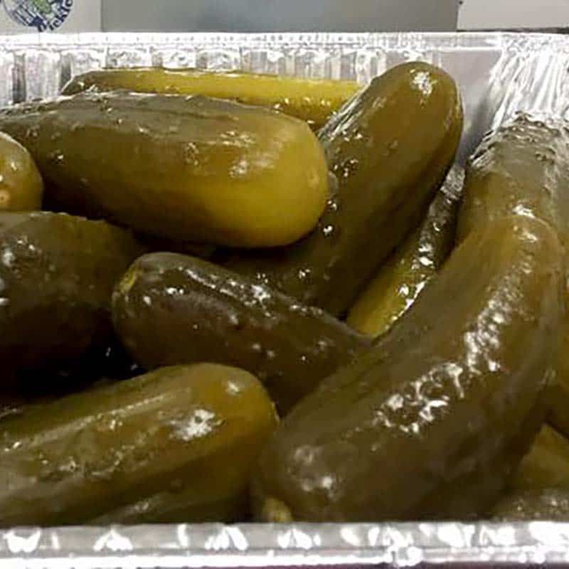 Tray of full sour pickles