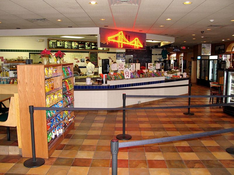 Syracuse East counter with the neon Brooklyn Bridge sign