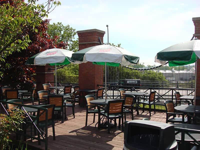 Syracuse East deck with green umbrellas