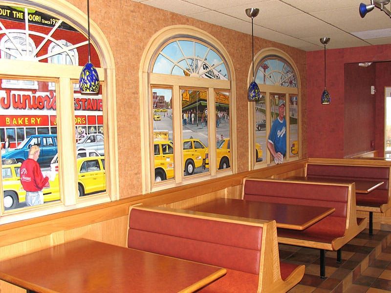 Syracuse East dining room with a New York City street mural